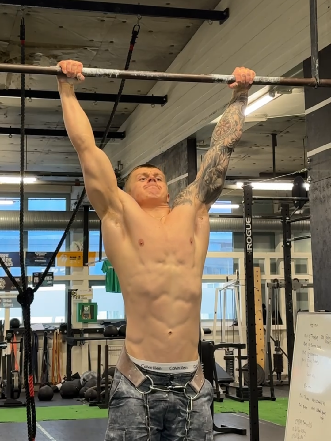 Coach performing a pull-up